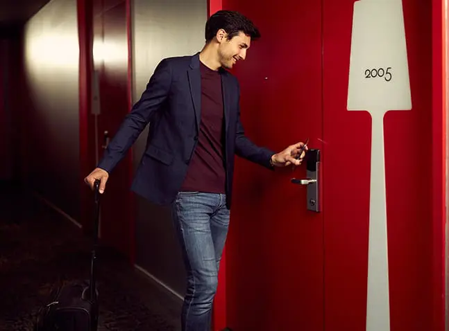 man at art'otel Amsterdam corridor