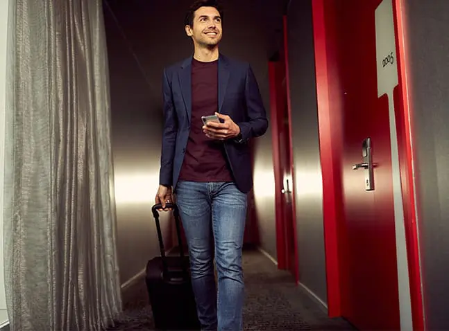 man at art'otel Amsterdam corridor