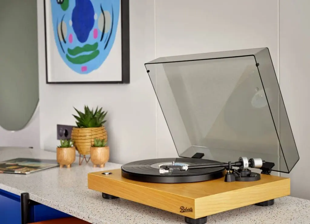 A turntable placed on a desk in an art'otel suite.