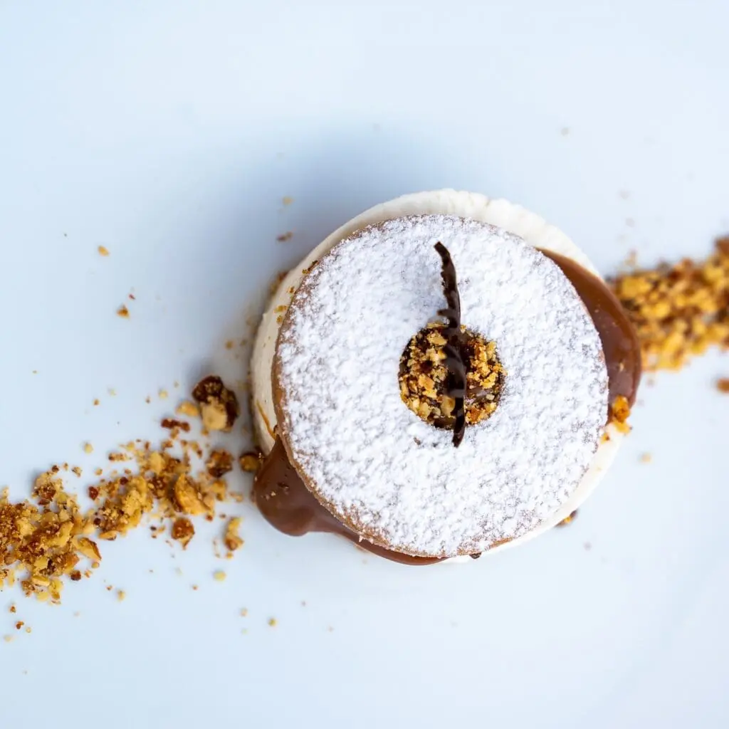A seasonal cheesecake filled with salted caramel and nuts. Dessert from Lume Osteria in Rome.