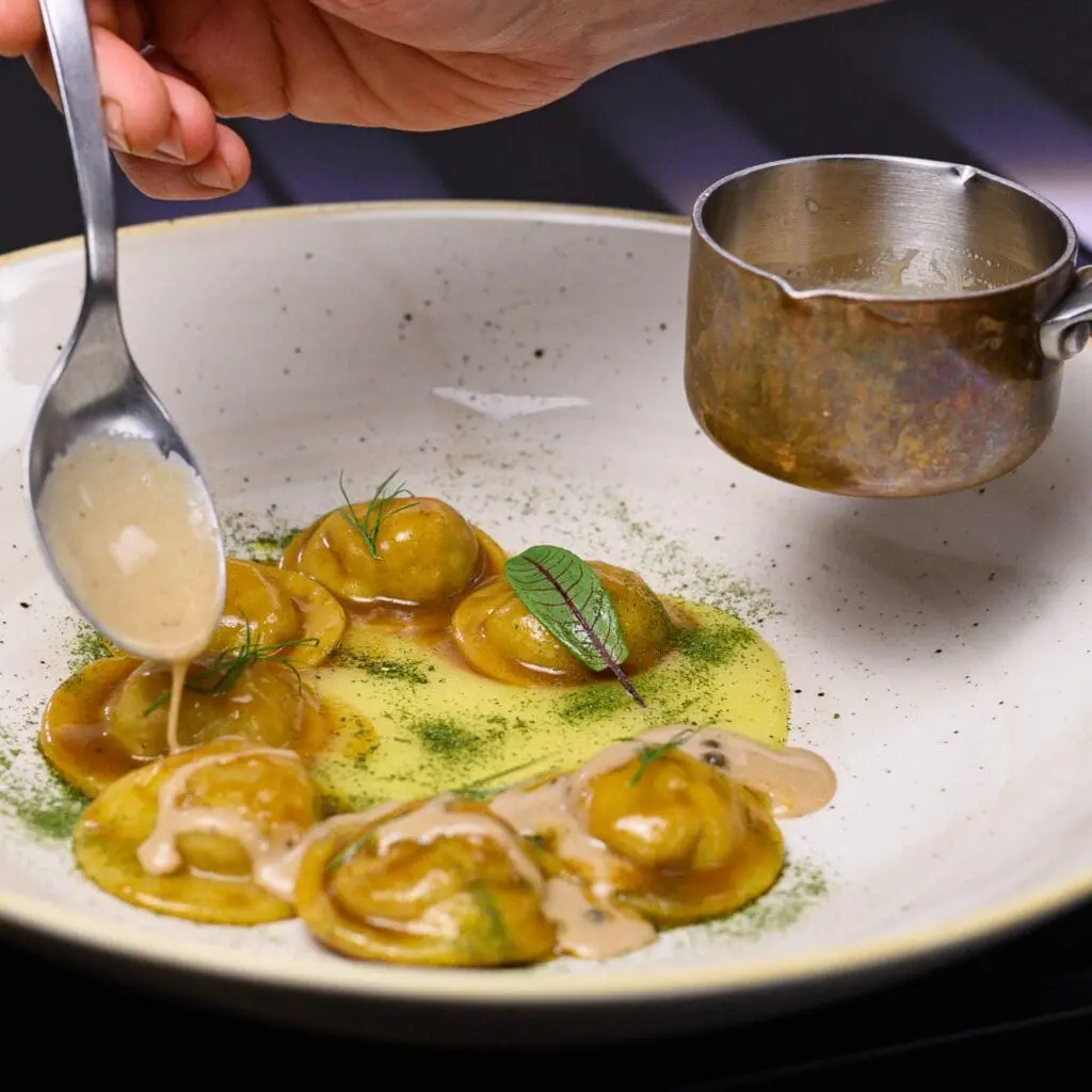 Homemade pasta, stuffed with sweet and sour pork, smoked potatoes and green pepper. Sinfonia del Gusto in Rome.