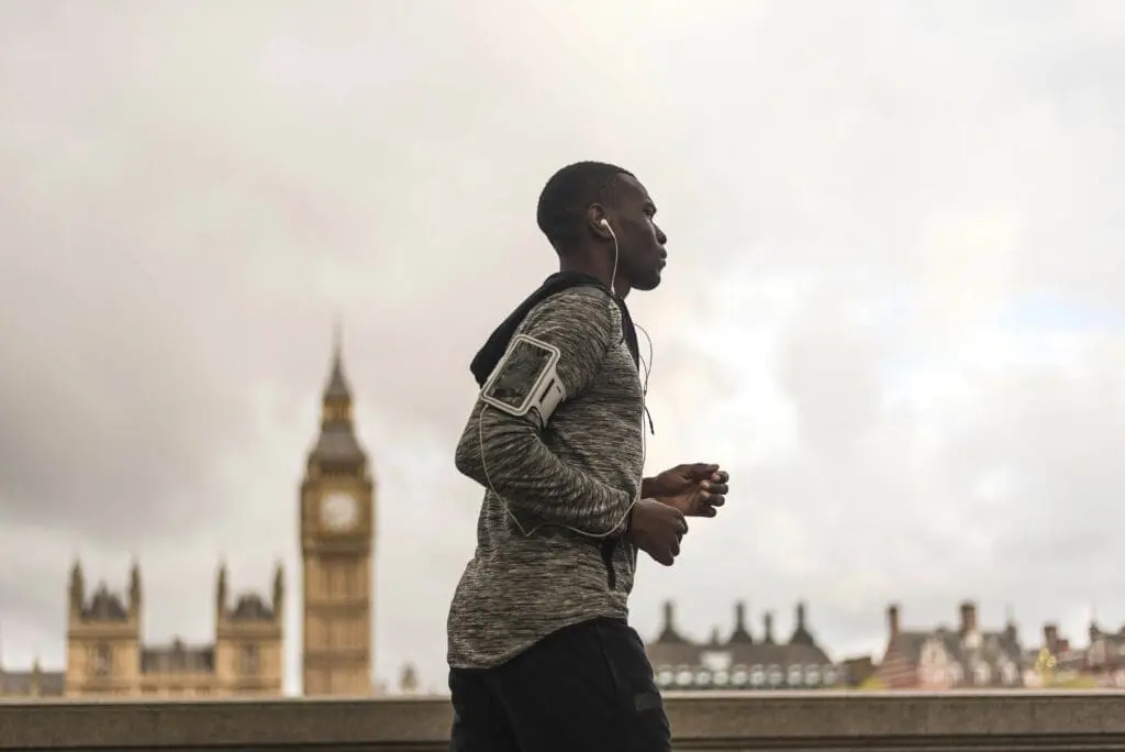 Man jogging past Big Ben in London