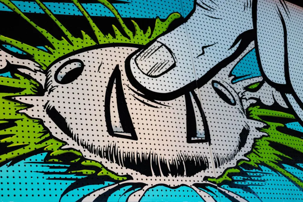 Close-up of vibrant pop art mural with bold comic-style design and bright green, blue, and black details at art'otel London Hoxton.