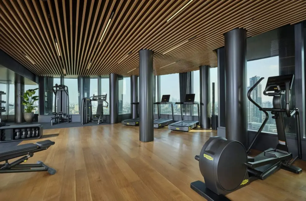 Indoor gym at art'otel London Hoxton Old Street hotel with pool.