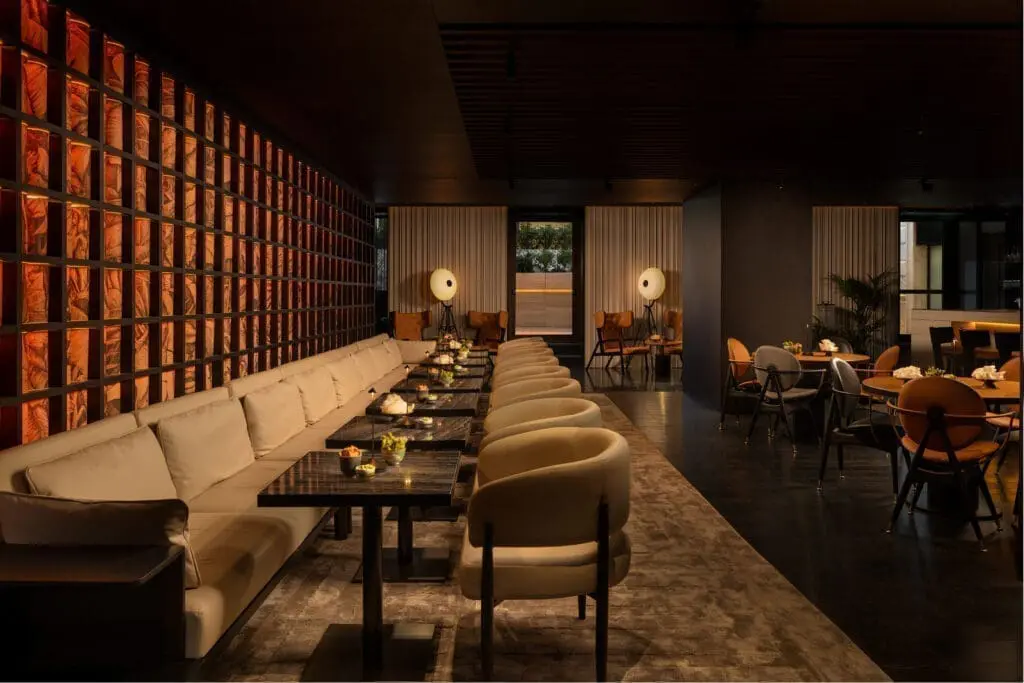 Sophisticated dining space at art’otel Yezi restaurant Roma with elegant seating, warm lighting, and modern decor.