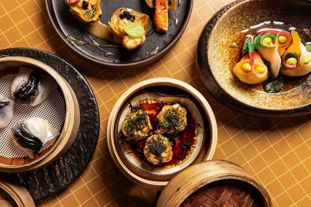 Exquisite gourmet dishes at art'otel Yezi restaurant Rome featuring colorful dim sum, elegant plating, and authentic Asian flavors.