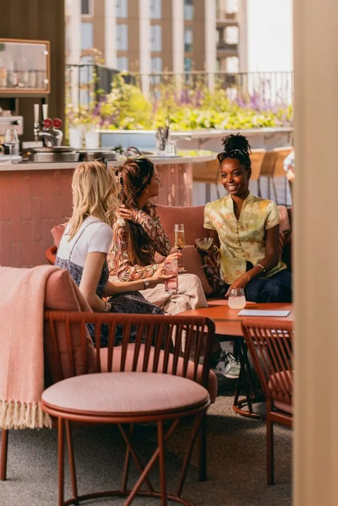 Outdoor terrace at art'otel Battersea Power Station restaurant & bar featuring stylish seating, modern design, and vibrant city backdrop.