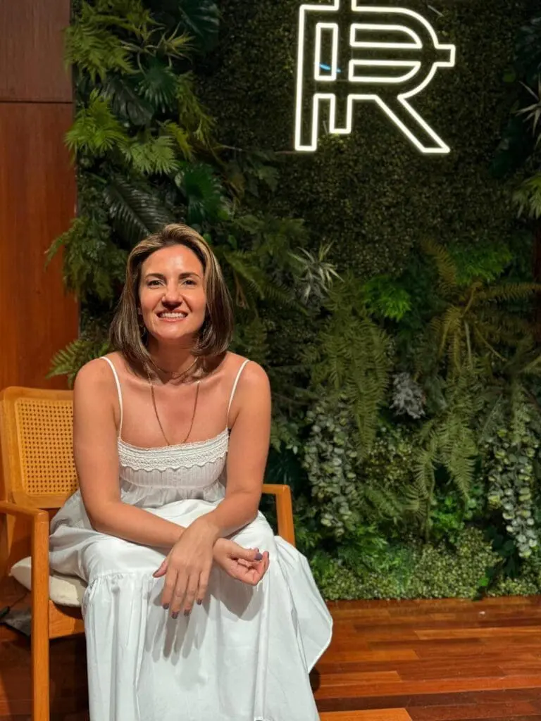 Indoor seating area with lush green wall at art'otel Hotel next to Battersea Power Station.