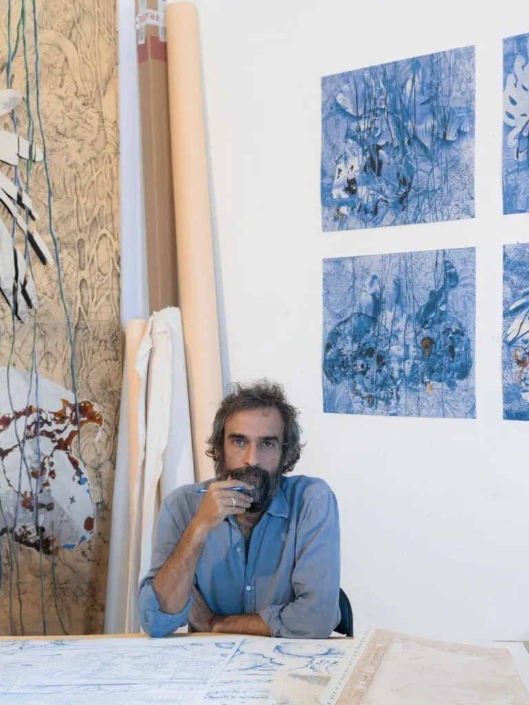 Artist Pietro Ruffo working on creative sketches at art gallery art'otel hotel Rome.