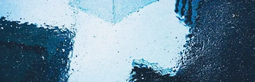 Abstract blue water texture resembling reflections and shadows, echoing the artistic visual style found throughout the art'ote Battersea Power Station view room.