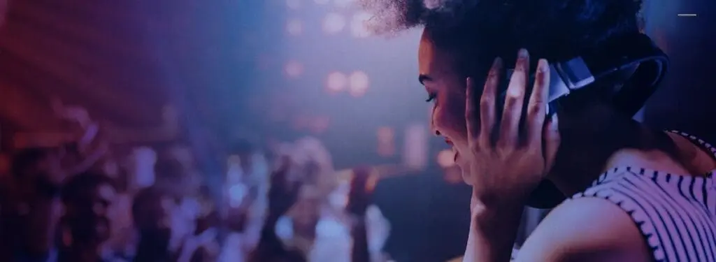 DJ performing at Perola cocktail bar Battersea with lively crowd