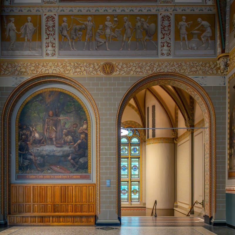 Interior shot of a hallway and painting in the Rijksmuseum in Amsterdam.