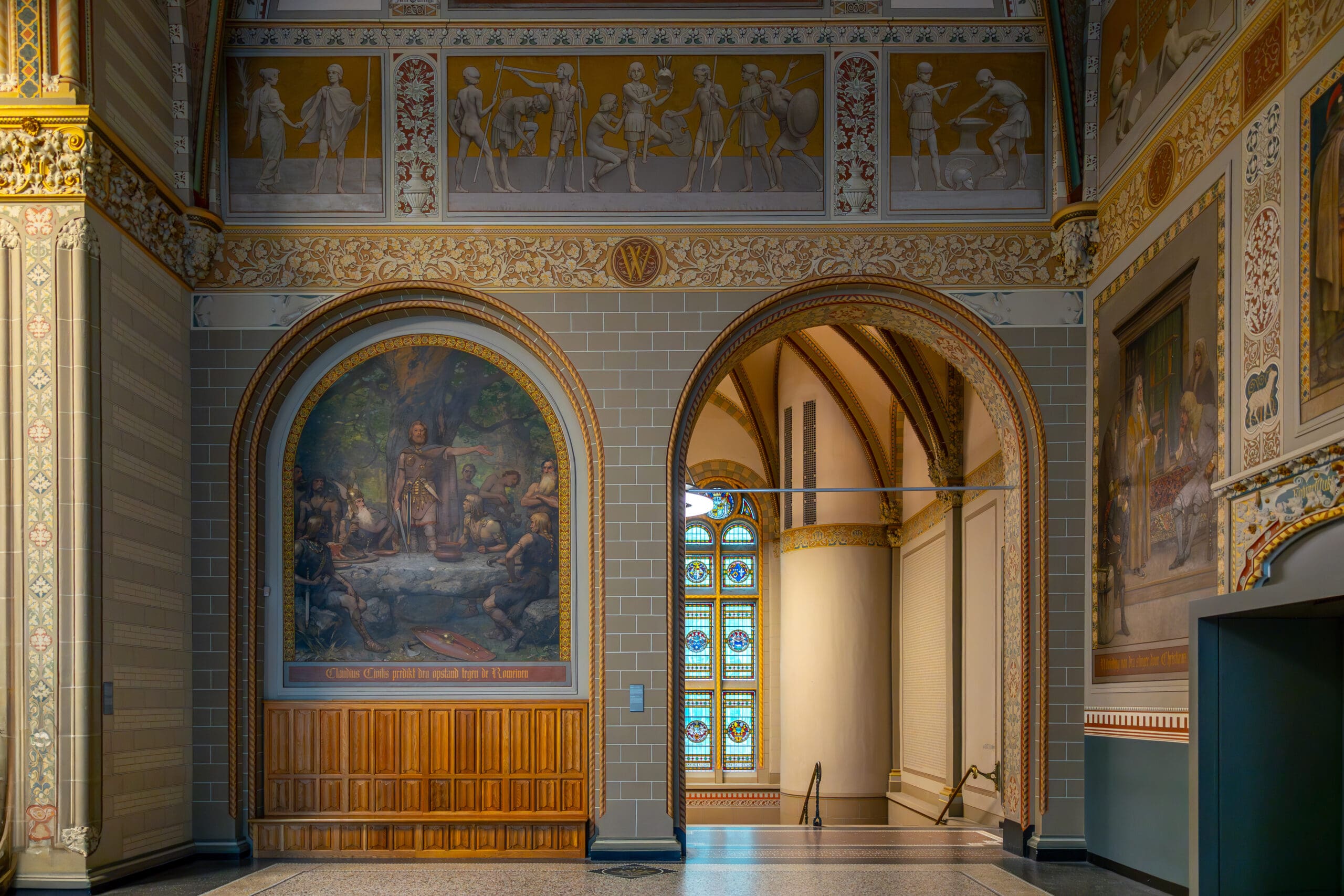 Interior shot of a hallway and painting in the Rijksmuseum in Amsterdam.